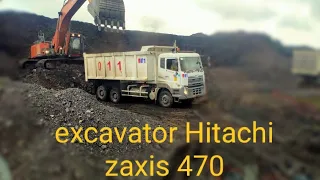 Excavator Hitachi Zaxis 470LC loading Trucks Dump UD Quester cwe 280 material batu bara