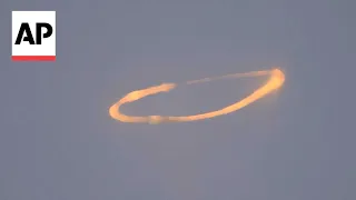 Mount Etna blows spectacular smoke rings into the sky