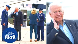Biden attacked by HUGE cicada as he departs on Air Force One for meetings with Putin and the Queen