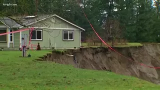 House at risk of falling into river