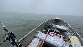 Tiny boat fishing Lake Erie early spring
