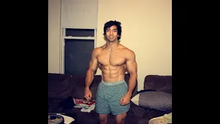 Fit muscular man working out and flexing