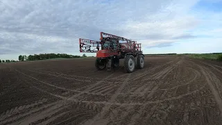 Spraying pre emerge chemical on corn.