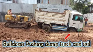 Bulldozer pushing dump truck and soil !!! complete 100 % !! mitsubishi bd2f working