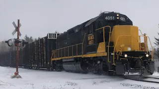 WAMX 4051 leads a log train into the snow with Wisconsin & Southern 4191 trailing