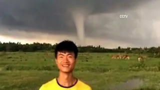 Watch massive, rare tornado pummel through