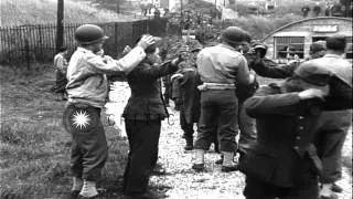 German prisoners march from a dock to a prison camp and are searched by US soldie...HD Stock Footage