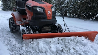 Husqvarna plowing snow