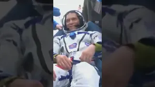 Astronaut returns to Earth after record flight