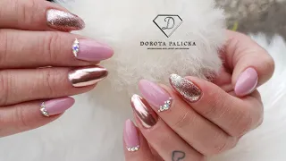 Gel infill, rebalance nails in pink with rose gold chrome pigment and Swarovski crystals.