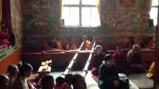 Tibetan Buddhist monks chanting in monastery in Nepal during a special puja