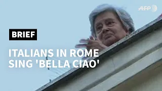 Italians in Rome sing 'Bella Ciao' as virus lockdown continues | AFP