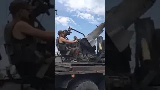Russian Soldier Fires Anti-Aircraft Gun Mounted on Ural Truck