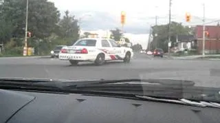 Toronto Police responding to assist with a police chase down the street