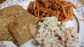 Spaghetti with coleslaw - Dutch koosla, “cabbage salad.” and garlic bread...