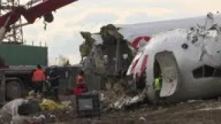 Crane lifts parts of Turkey crash plane from site
