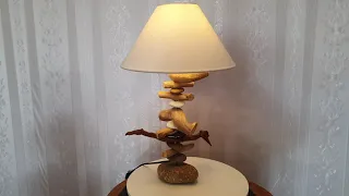 the table lamp made by driftwood.  gravel ..made in Vietnam