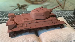 Weathering a T34 tank model with winter white wash.