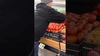 Hand stacking tomatoes 🍅