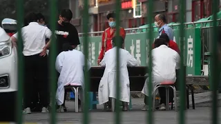 Beijing district on lockdown after coronavirus spike shuts market