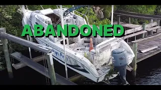 Abandoned Boat and Fishing at the Dam