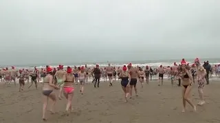 Hundreds take New Year plunge in Dutch seaside town