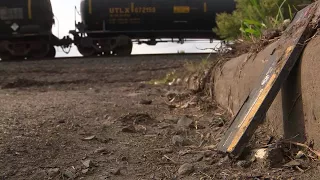 Dozens of lithium batteries on train tracks after train car explosion