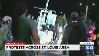 Raw: Protesters topple sign, break windows in Ferguson as tensions rise