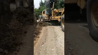 Grader clearing the forest road