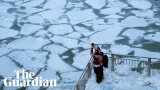 Polar vortex: -46C temperatures as Chicago River turns to ice