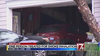 1 person treated for smoke inhalation following Apex garage fire