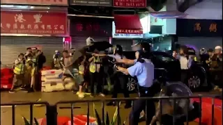 Hong Kong police fires first 'warning shot' amid protests