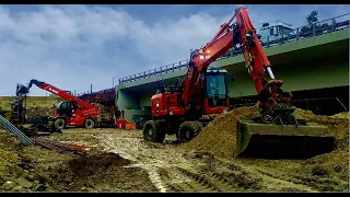 KOMATSU PW-160. Excavate the bridge support.