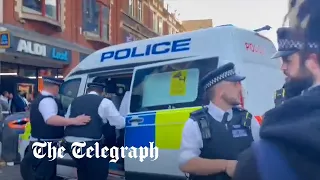 Video appears to show police officer repeatedly hitting an individual in the head in Dalston