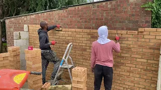 Laying the block walls of the garden office