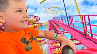 FIRST ROLLER COASTER RIDE at FUN FAIR! CALEB RIDES OUTDOOR AMUSEMENT PARK RIDES for KIDS with MOM!