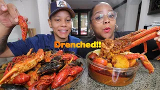 DRENCHED CRAB LEGS, CRAWFISH, MUSSELS IN SEAFOOD BOIL SAUCE!