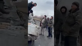 Ukrainian Defence Volunteers Inspect Damaged Russian Tank near Kyiv