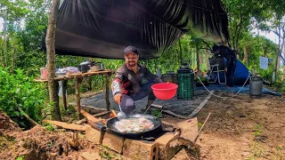 WE FISHED, BROKE CAMP AND MADE FISH FRIED ON THE PLOW DISC ON THE RIVER'S EDGE