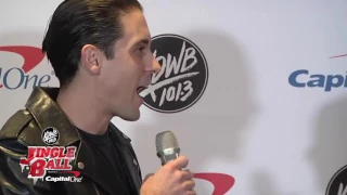 G-Eazy opens his Christmas stocking from Raven backstage at #KDWBJingleBall