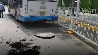 Utility hole explodes underneath bus in central China's Wuhan city