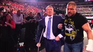 Triple H assists Mr. McMahon backstage after their fight with Brock Lesnar & Paul Heyman