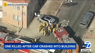 Person dies after being pinned between SUV and building in South LA