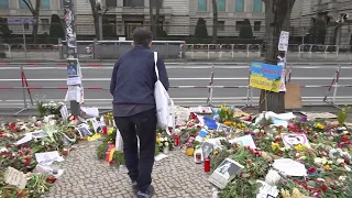 People place flowers outside Russia embassy in Berlin as opposition leader Navalny is buried in Mosc