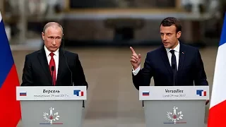 Macron slams Russian media 'lies' during exchange with Putin