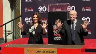 James Bond producers Michael G. Wilson and Barbara Broccoli place their handprints in cement