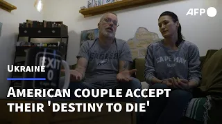American couple in Kyiv accept their 'destiny to die' rather than flee | AFP