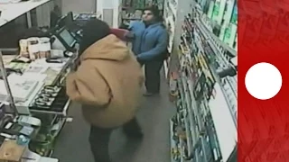 Female shopkeeper shows armed robbers who's boss!