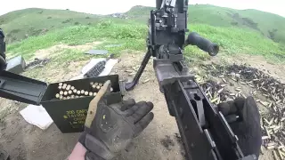 Marines firing a pair of M240B machine guns