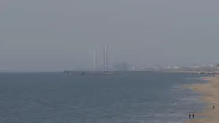 More trucks roll off new floating US aid pier in Gaza; blasts heard and smoke seen from Gaza skyline